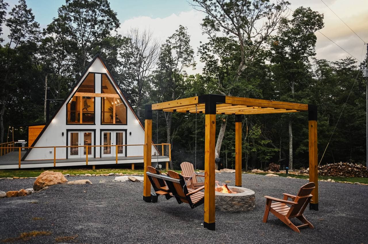 The Sparrow A-frame at dusk with fire pit